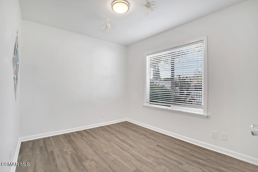 2353 Bryson Place Simi Valley, CA 93065 - Photo 15 of 31 a view of an empty room with wooden floor and a window