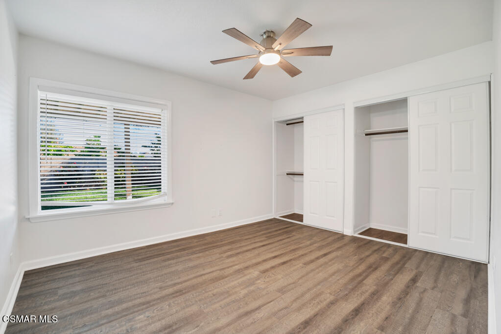 2353 Bryson Place Simi Valley, CA 93065 - Photo 19 of 31 a view of an empty room with wooden floor and a window