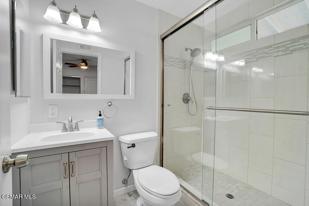 2353 Bryson Place Simi Valley, CA 93065 - Photo 21 of 31 a bathroom with a sink a toilet and shower