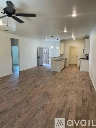 a living room with kitchen island furniture and a wooden floor