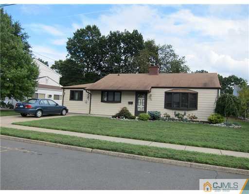 22 Fairfax Road Edison, NJ 08817 - Photo 8 of 8 a front view of a house with a garden and trees
