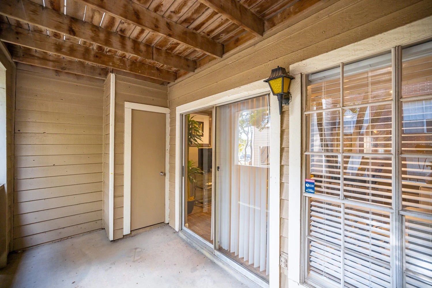 1773 Wells Branch Parkway, Unit 1018 Austin, TX 78728 - Photo 15 of 21 a view of a porch with wooden floor