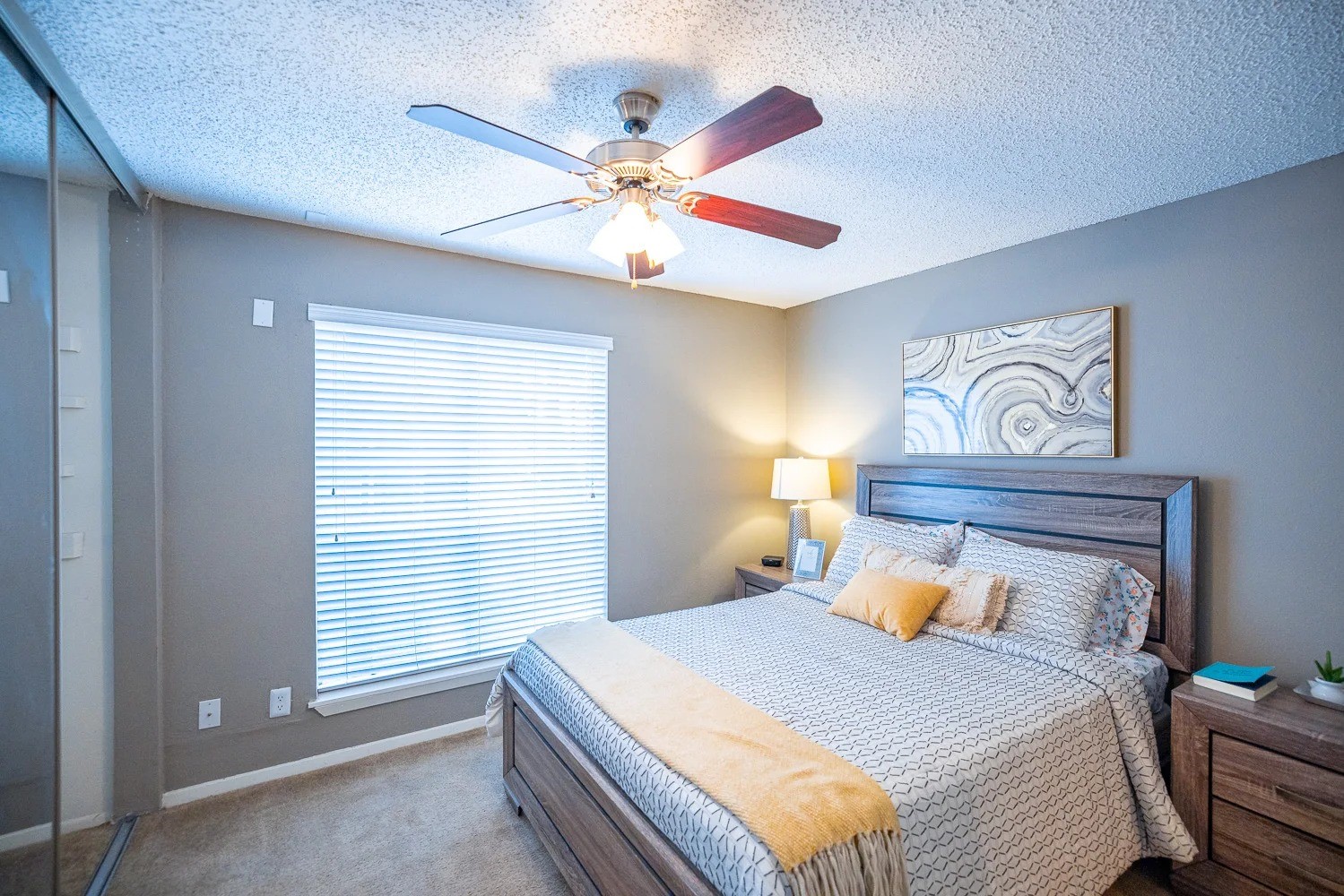 1773 Wells Branch Parkway, Unit 1018 Austin, TX 78728 - Photo 2 of 21 a bedroom with a bed and a chandelier