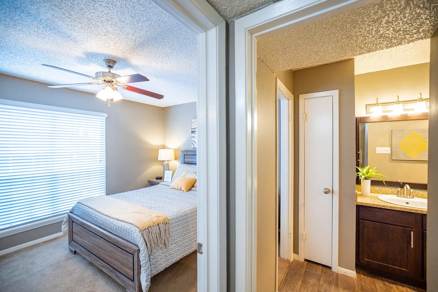 1773 Wells Branch Parkway, Unit 1018 Austin, TX 78728 - Photo 3 of 21 a bedroom with a bed and a chandelier