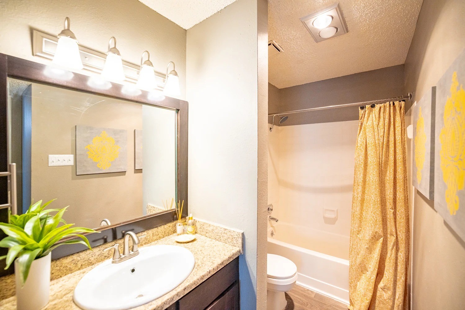 1773 Wells Branch Parkway, Unit 1018 Austin, TX 78728 - Photo 5 of 21 a bathroom with a granite countertop sink toilet and shower