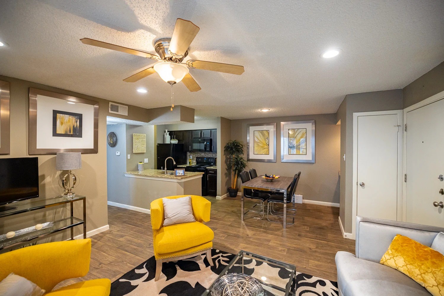 1773 Wells Branch Parkway, Unit 1018 Austin, TX 78728 - Photo 8 of 21 a living room with furniture and a flat screen tv