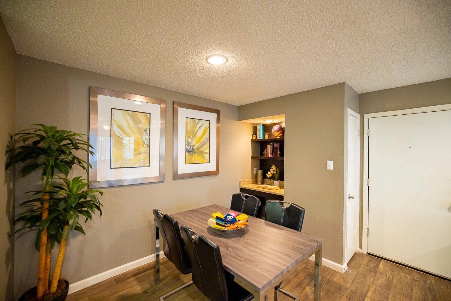 1773 Wells Branch Parkway, Unit 1018 Austin, TX 78728 - Photo 9 of 21 a dining room with furniture and a potted plant