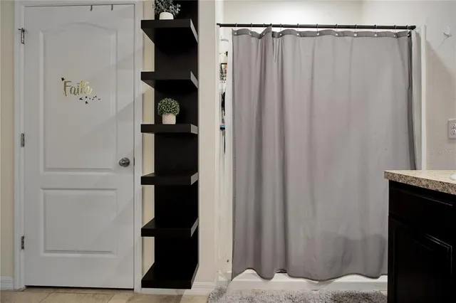 a bathroom with a sink double vanity and a mirror