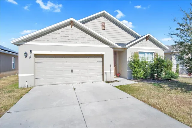 a kitchen with stainless steel appliances granite countertop a refrigerator sink and cabinets