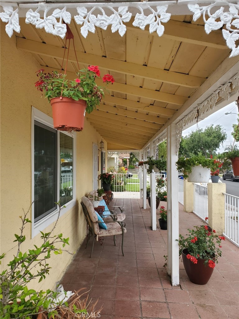 6824 Marcelle Street Paramount, CA 90723 - Photo 15 of 46 a building outdoor space with patio furniture and potted plants