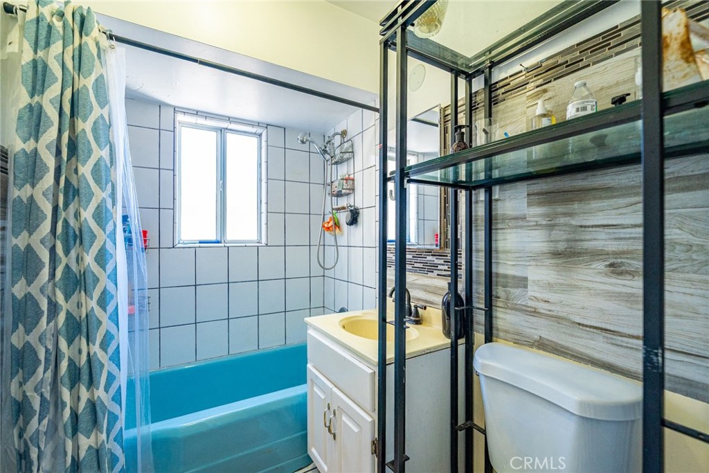 6824 Marcelle Street Paramount, CA 90723 - Photo 19 of 46 a bathroom with a tub and shower