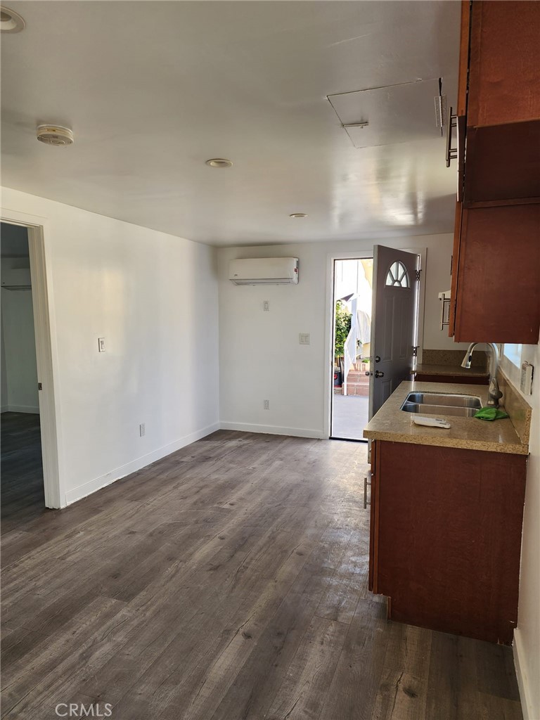 6824 Marcelle Street Paramount, CA 90723 - Photo 30 of 46 a view of a kitchen counter space and wooden floor