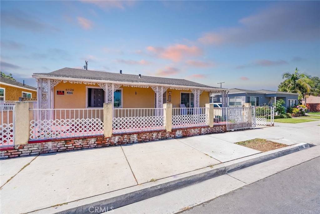 6824 Marcelle Street Paramount, CA 90723 - Photo 3 of 46 front view of a house with a outdoor space
