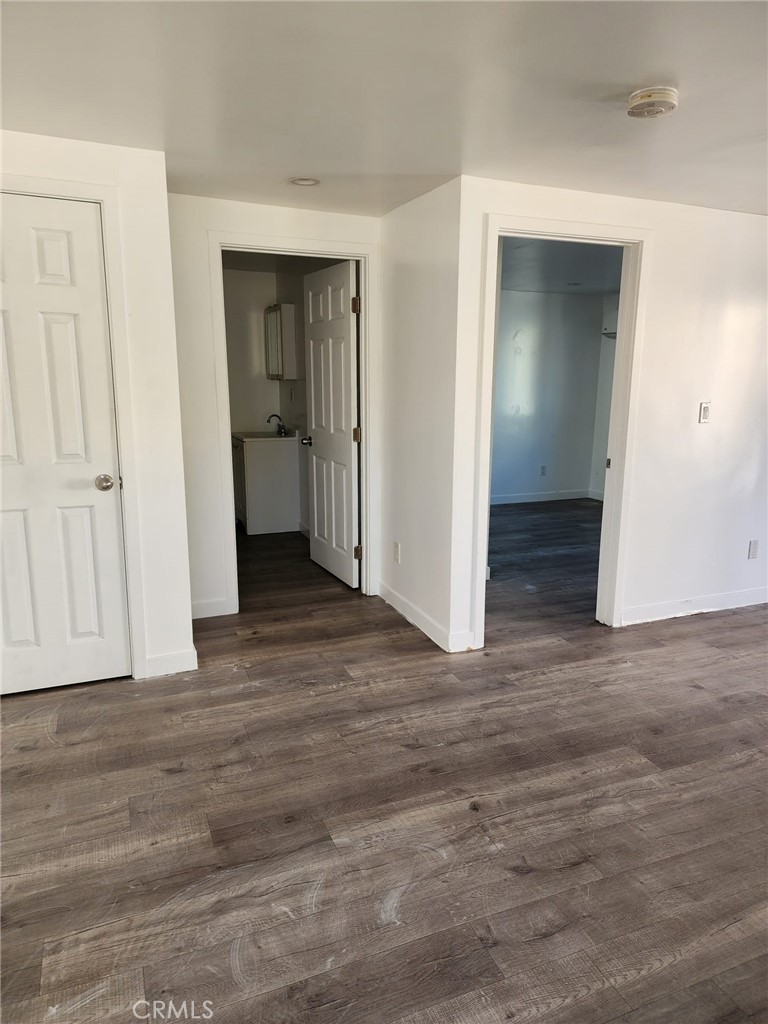6824 Marcelle Street Paramount, CA 90723 - Photo 31 of 46 a view of an empty room with wooden floor and closet