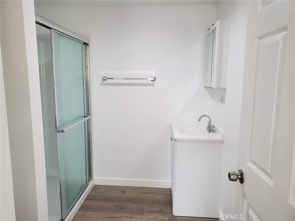 6824 Marcelle Street Paramount, CA 90723 - Photo 34 of 46 a bathroom with a sink and mirror