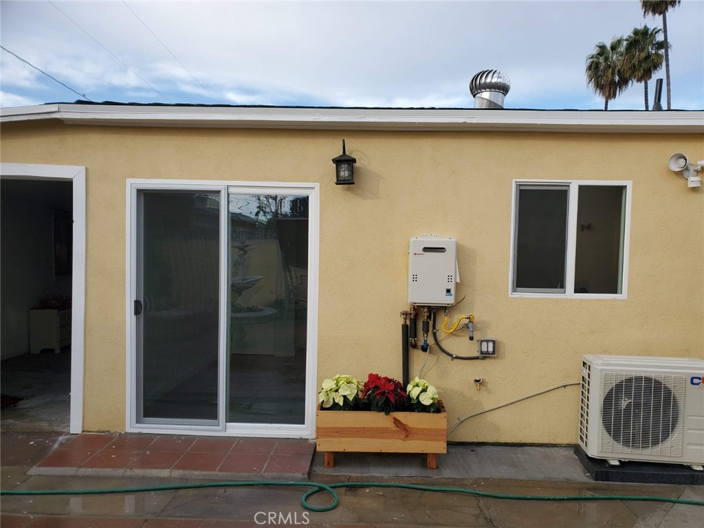 6824 Marcelle Street Paramount, CA 90723 - Photo 6 of 46 a front view of a house with entryway