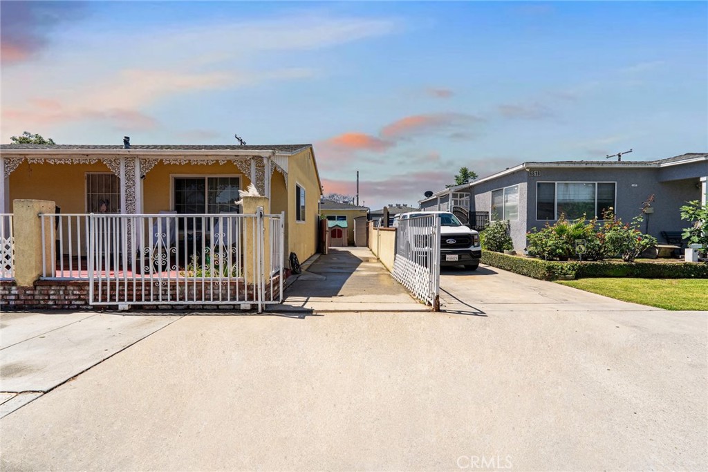 6824 Marcelle Street Paramount, CA 90723 - Photo 7 of 46 a view of a house with a patio