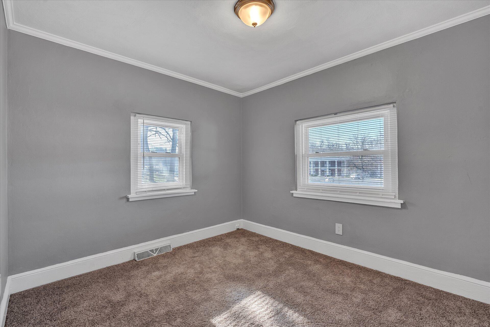 1329 Peters Creek Road Roanoke, VA 24017 - Photo 12 of 27 a view of an empty room with a window