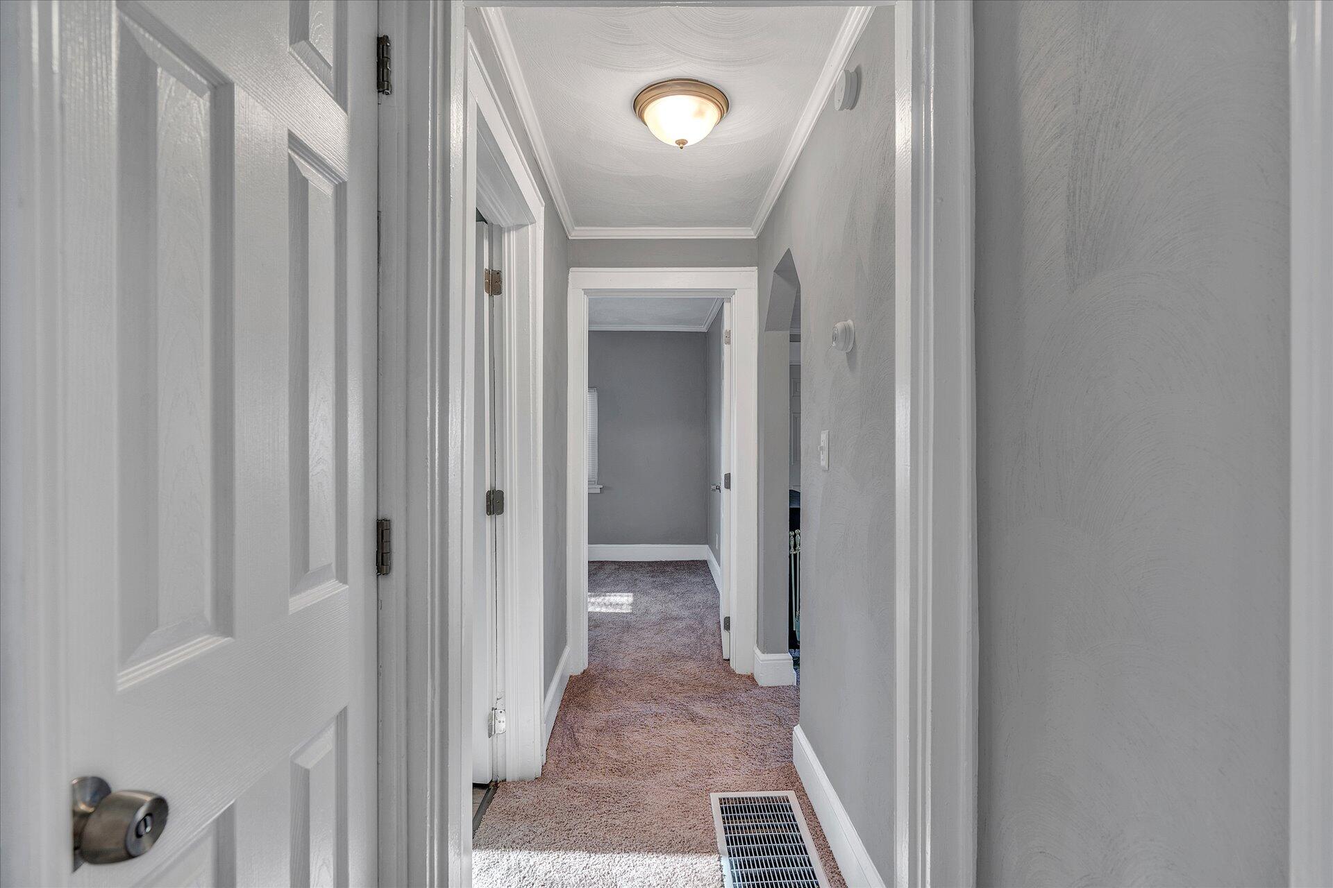 1329 Peters Creek Road Roanoke, VA 24017 - Photo 18 of 27 a view of a hallway with wooden floor and closet