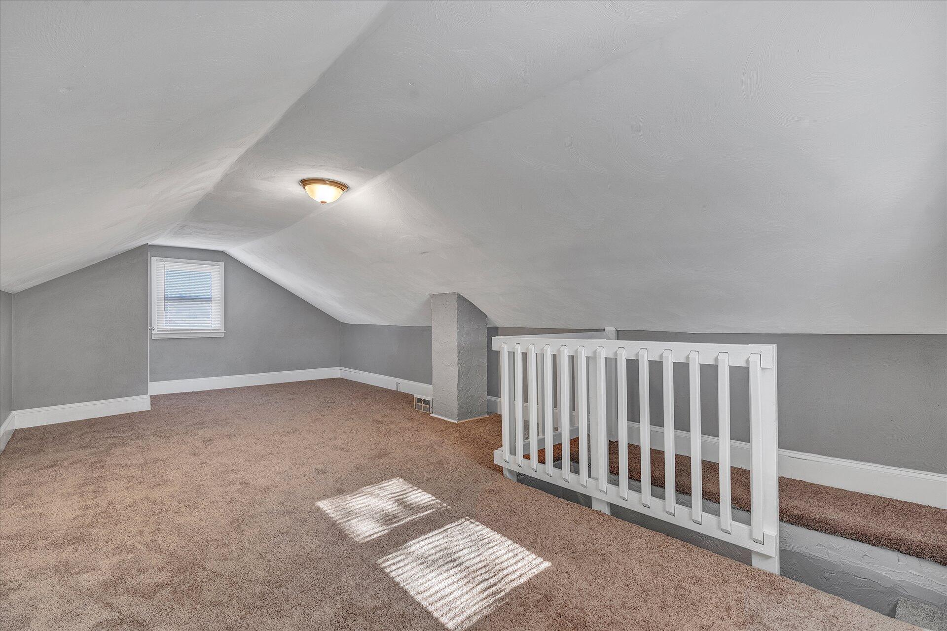 1329 Peters Creek Road Roanoke, VA 24017 - Photo 20 of 27 a view of a hallway with wooden floor and stairs