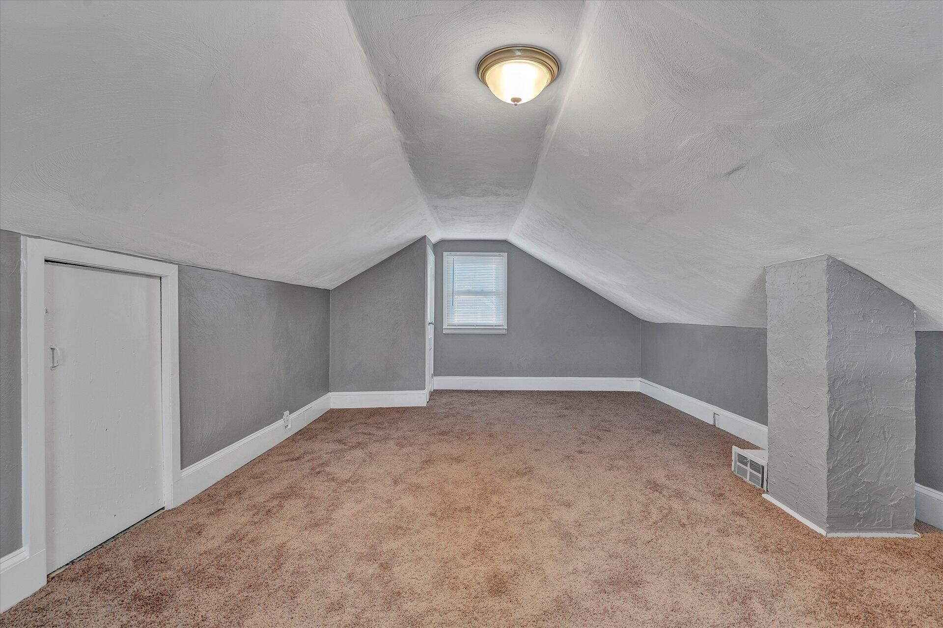1329 Peters Creek Road Roanoke, VA 24017 - Photo 22 of 27 a view of an empty room with a window