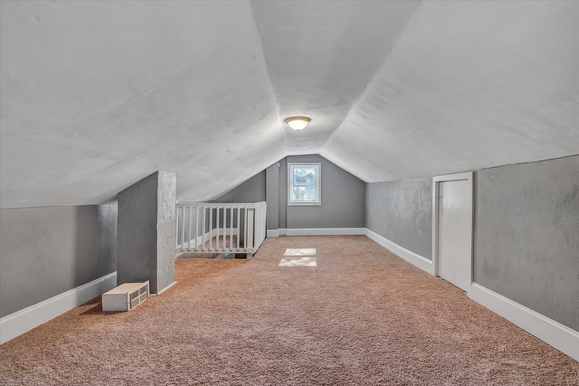 1329 Peters Creek Road Roanoke, VA 24017 - Photo 24 of 27 a view of empty room with wooden floor and window