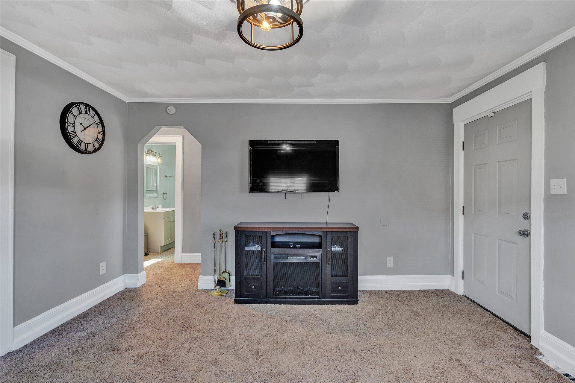 1329 Peters Creek Road Roanoke, VA 24017 - Photo 4 of 27 a living room with furniture and a fireplace