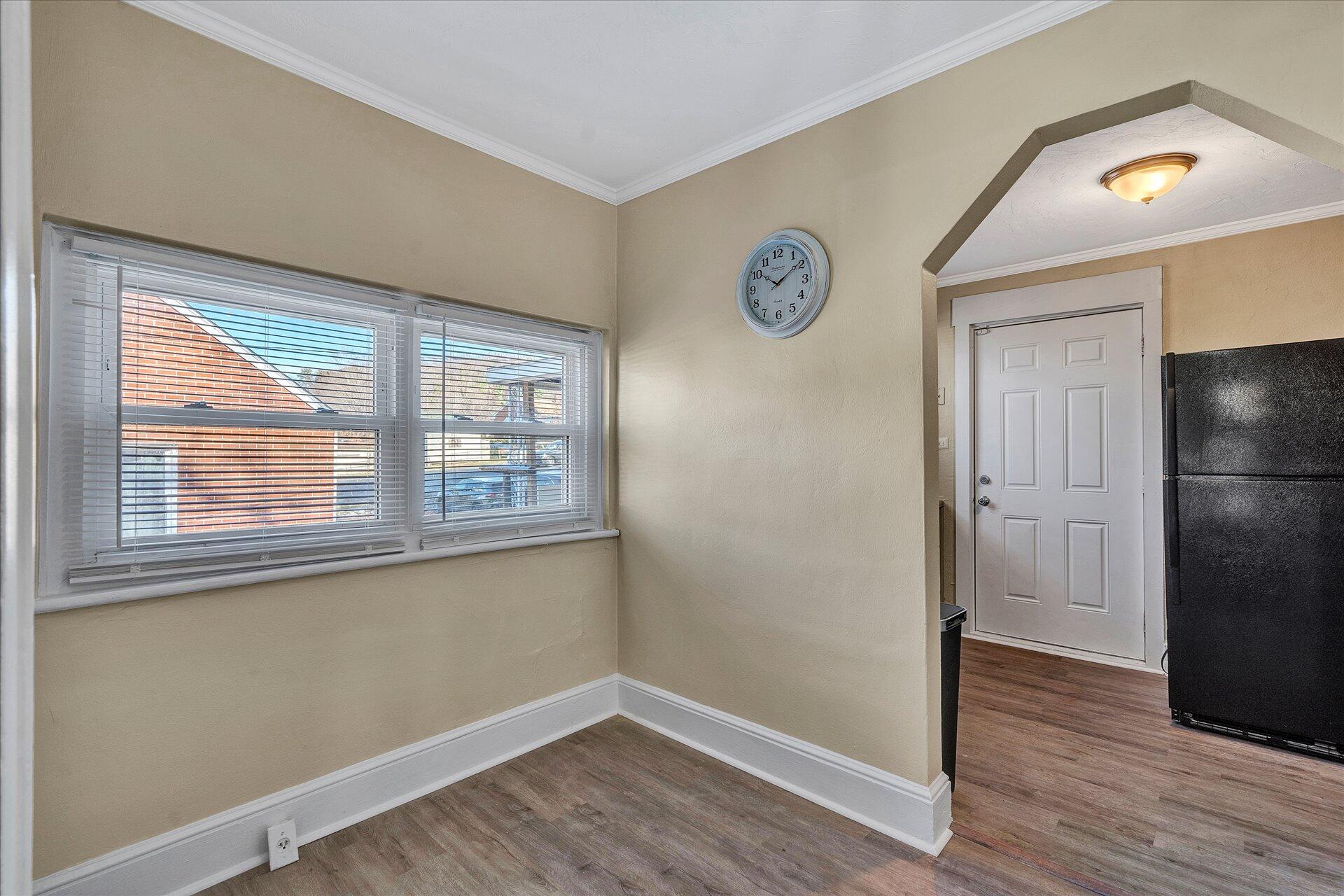 1329 Peters Creek Road Roanoke, VA 24017 - Photo 5 of 27 a view of a livingroom with wooden floor and a window