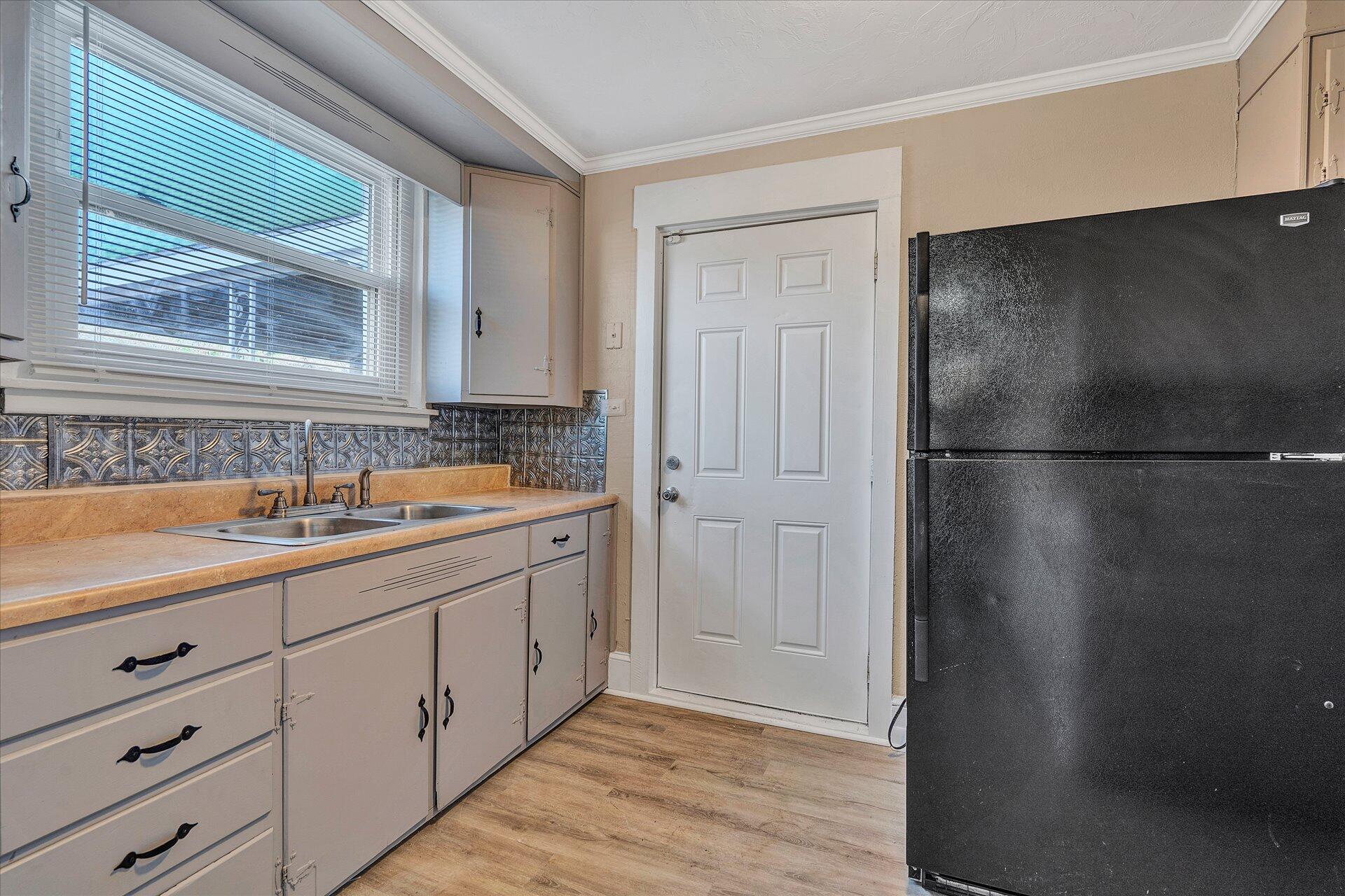 1329 Peters Creek Road Roanoke, VA 24017 - Photo 6 of 27 a bathroom with a sink and a mirror