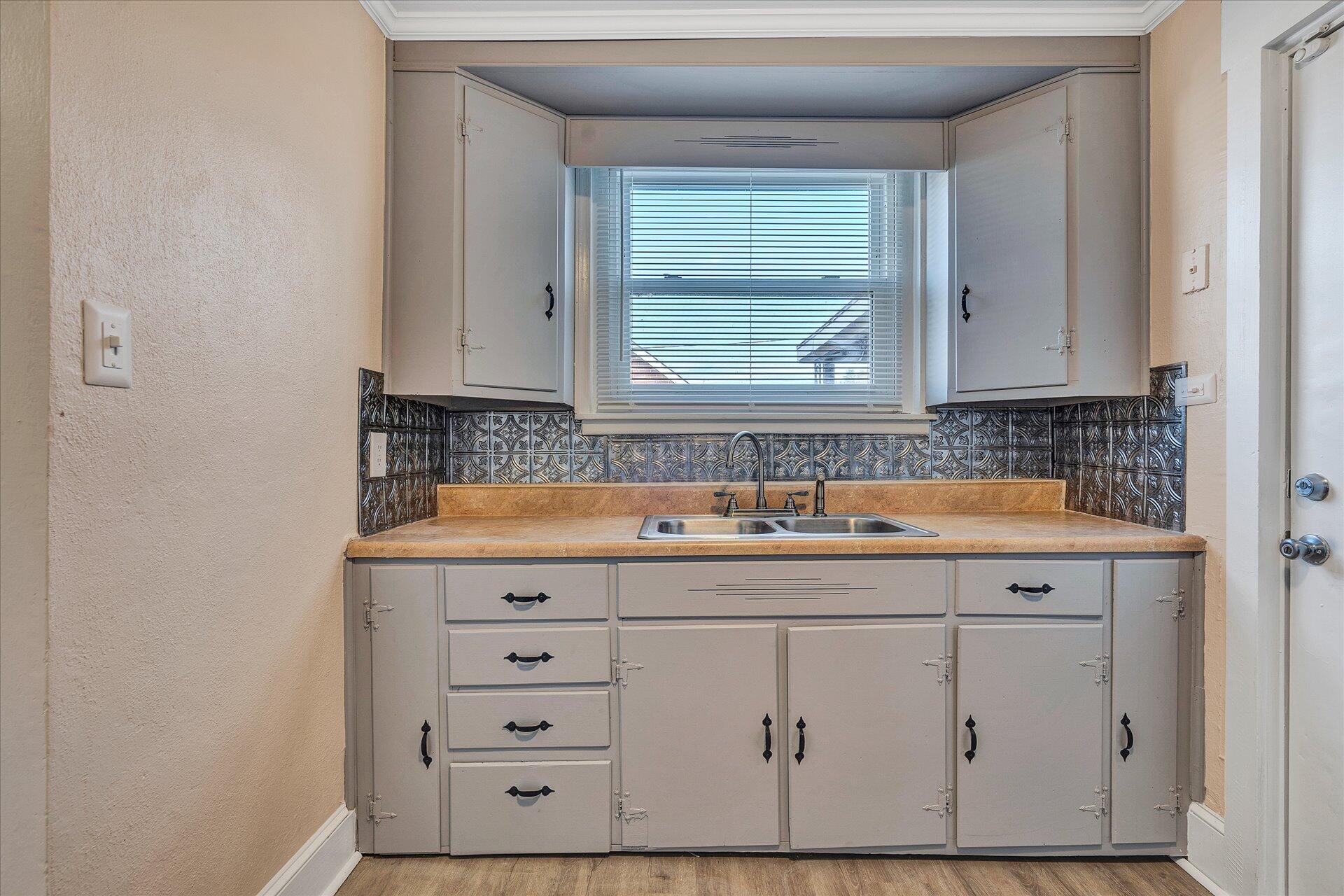 1329 Peters Creek Road Roanoke, VA 24017 - Photo 7 of 27 a bathroom with a sink and a mirror
