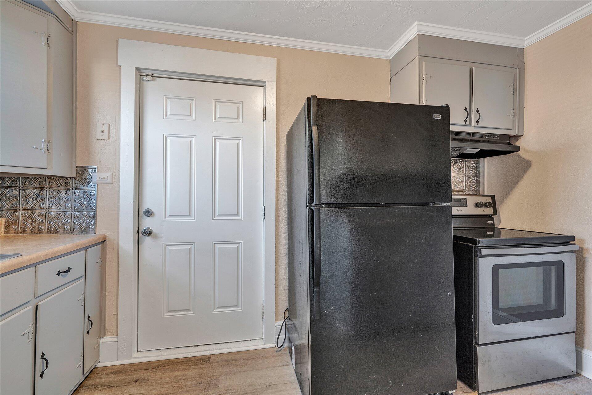 1329 Peters Creek Road Roanoke, VA 24017 - Photo 9 of 27 a kitchen with cabinets and stainless steel appliances