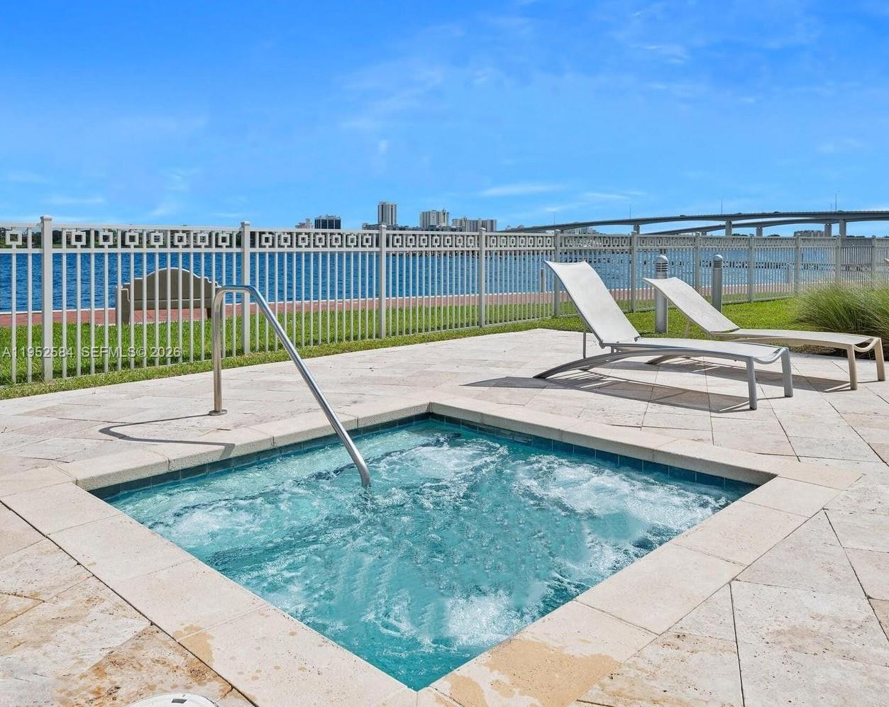 231 Riverside Drive, Unit 708 Daytona Beach, FL 32117 - Photo 14 of 17 a view of a swimming pool with a patio and a yard