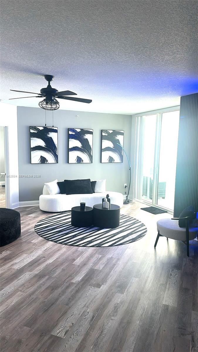 231 Riverside Drive, Unit 708 Daytona Beach, FL 32117 - Photo 6 of 17 a living room with furniture and a large window