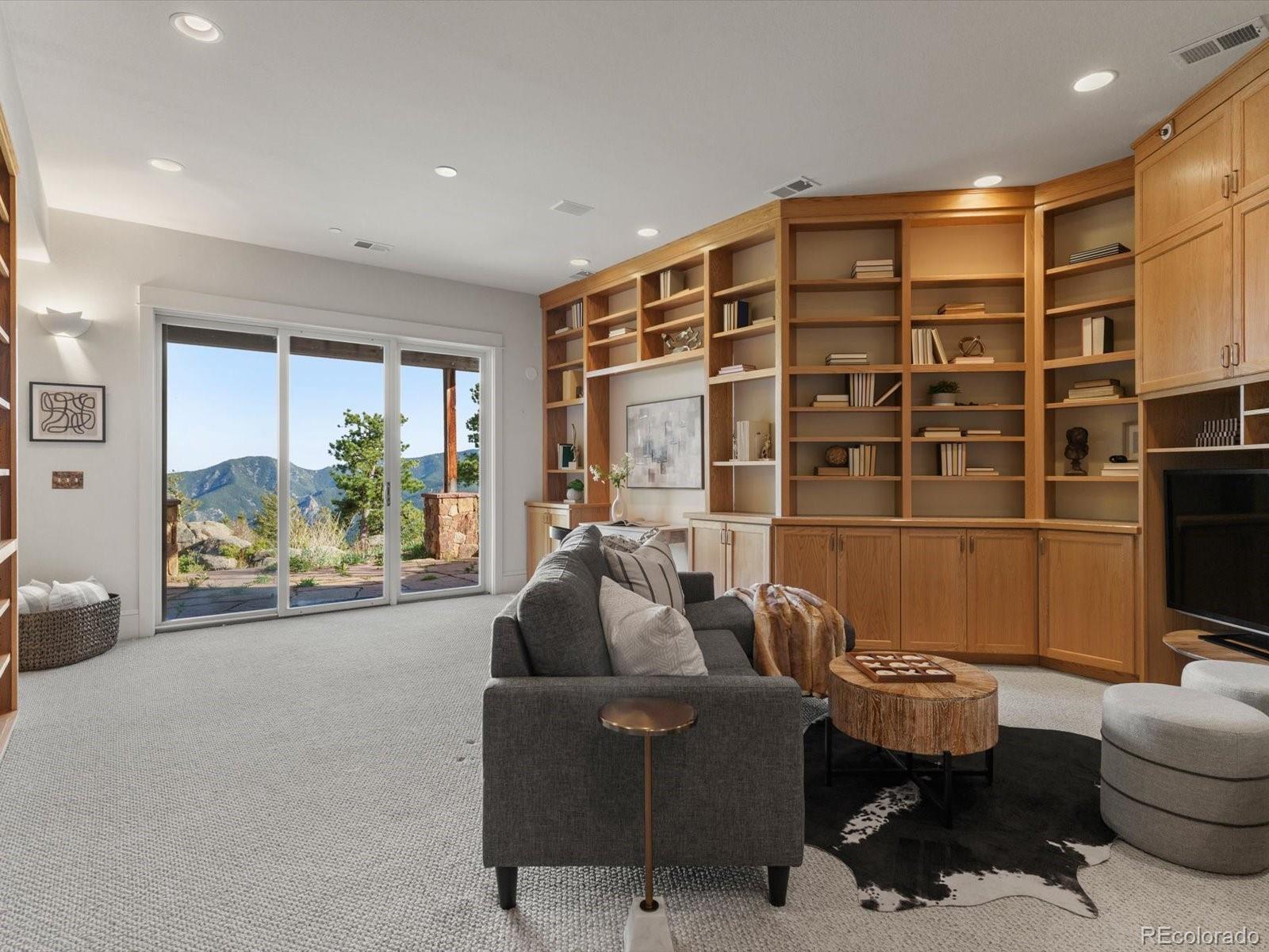 6264 Flagstaff Road Boulder, CO 80302 - Photo 12 of 50 a living room with furniture and a floor to ceiling window