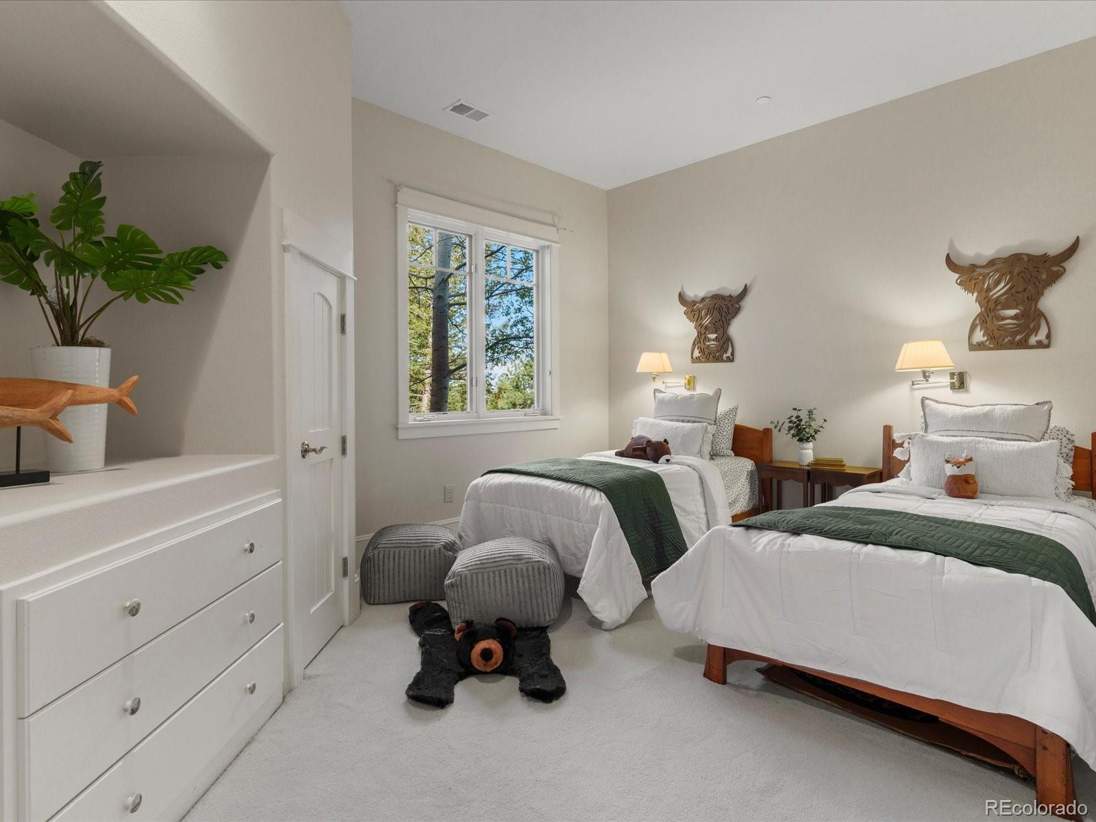6264 Flagstaff Road Boulder, CO 80302 - Photo 15 of 50 a bedroom with two beds and potted plant on the dresser