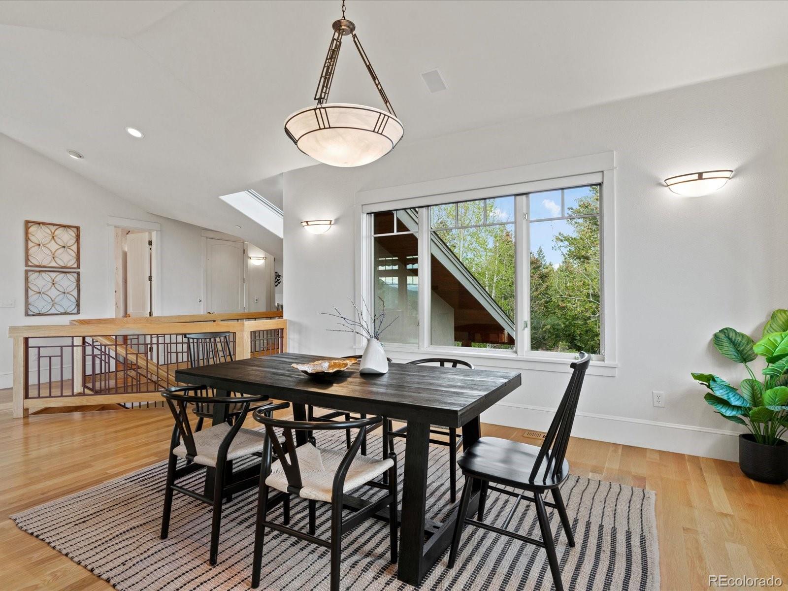 6264 Flagstaff Road Boulder, CO 80302 - Photo 18 of 50 a view of a dining room with furniture window and wooden floor