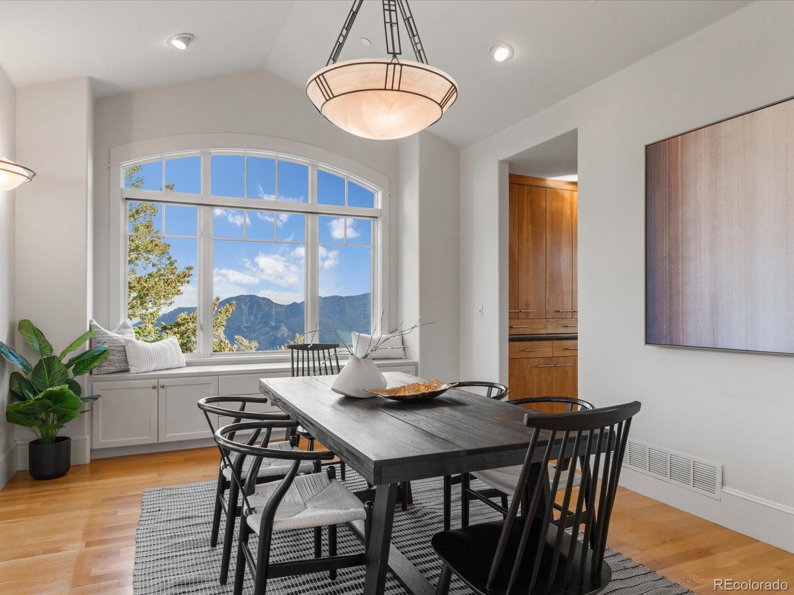 6264 Flagstaff Road Boulder, CO 80302 - Photo 19 of 50 a view of a dining room with furniture window and wooden floor