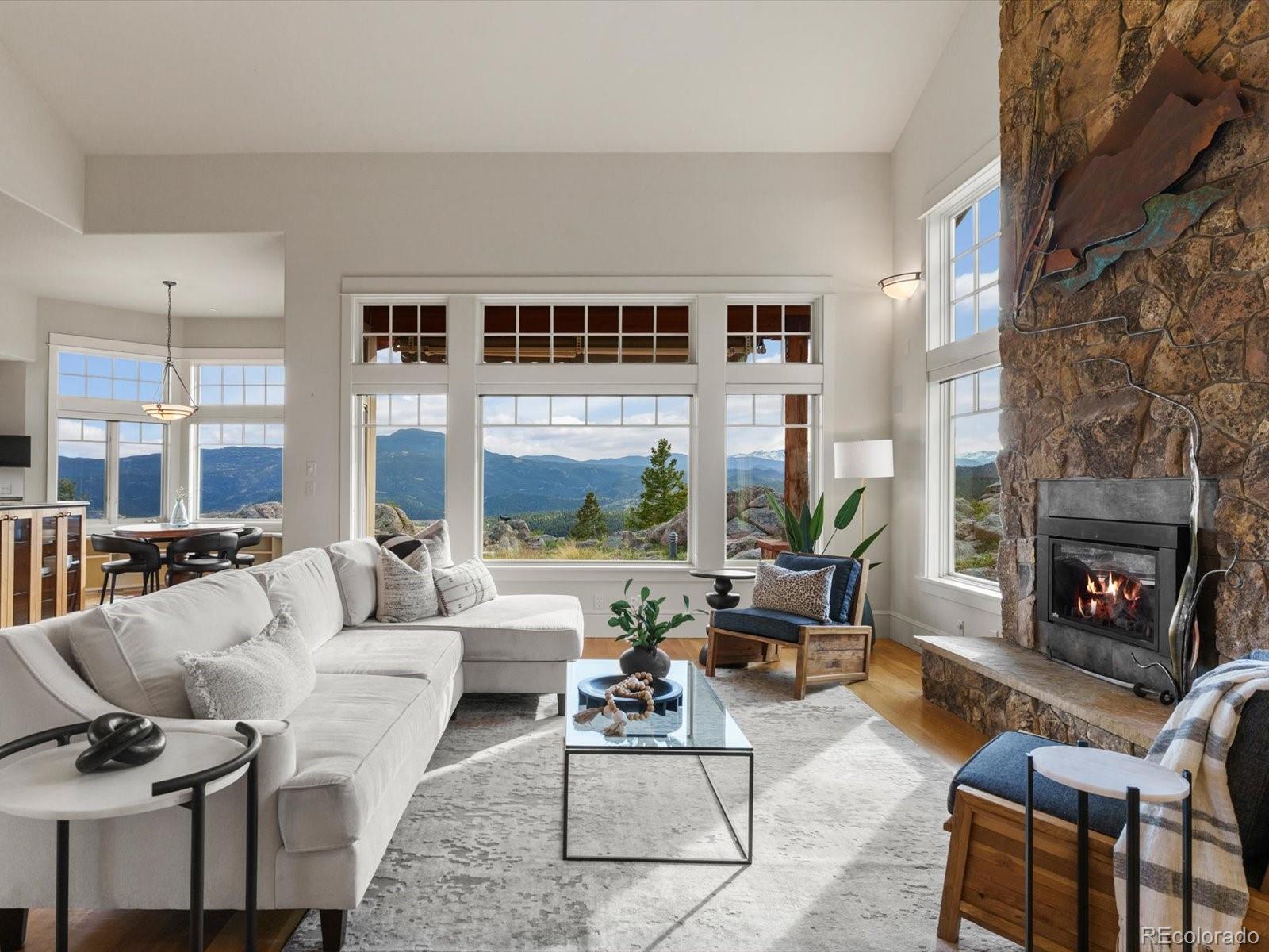 6264 Flagstaff Road Boulder, CO 80302 - Photo 22 of 50 a living room with furniture and a fireplace