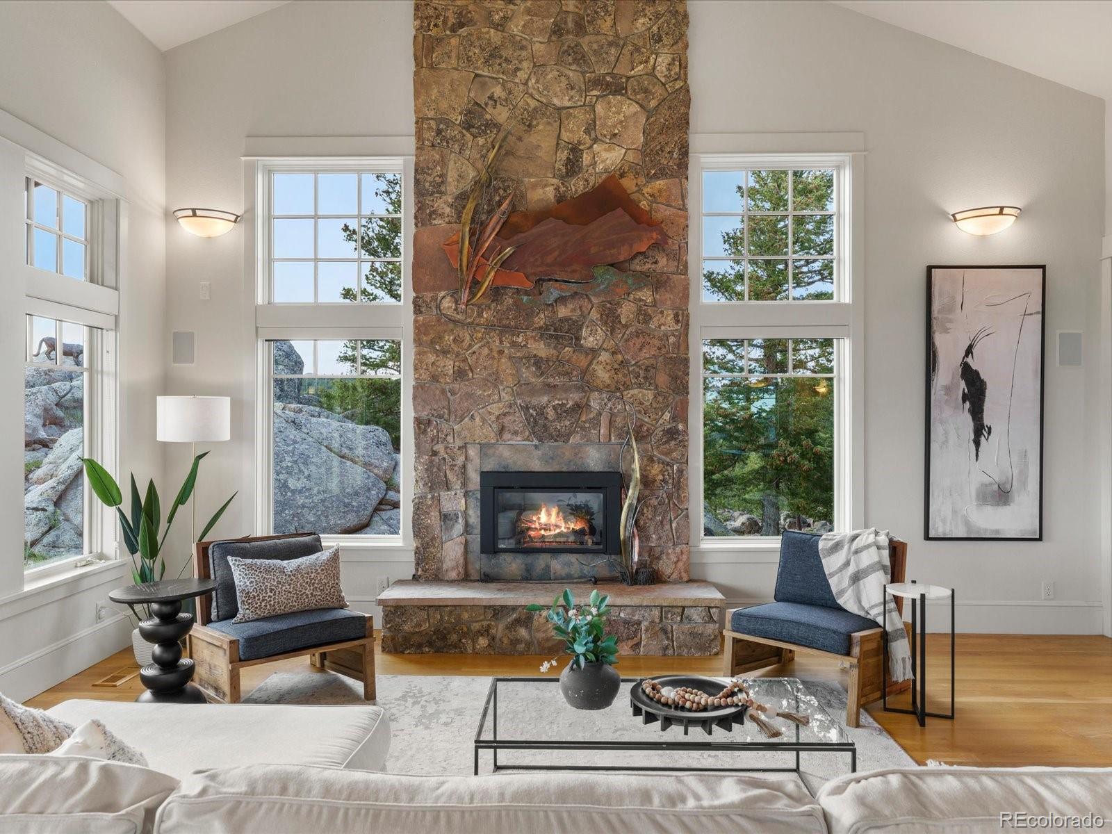 6264 Flagstaff Road Boulder, CO 80302 - Photo 23 of 50 a living room with furniture and a fireplace