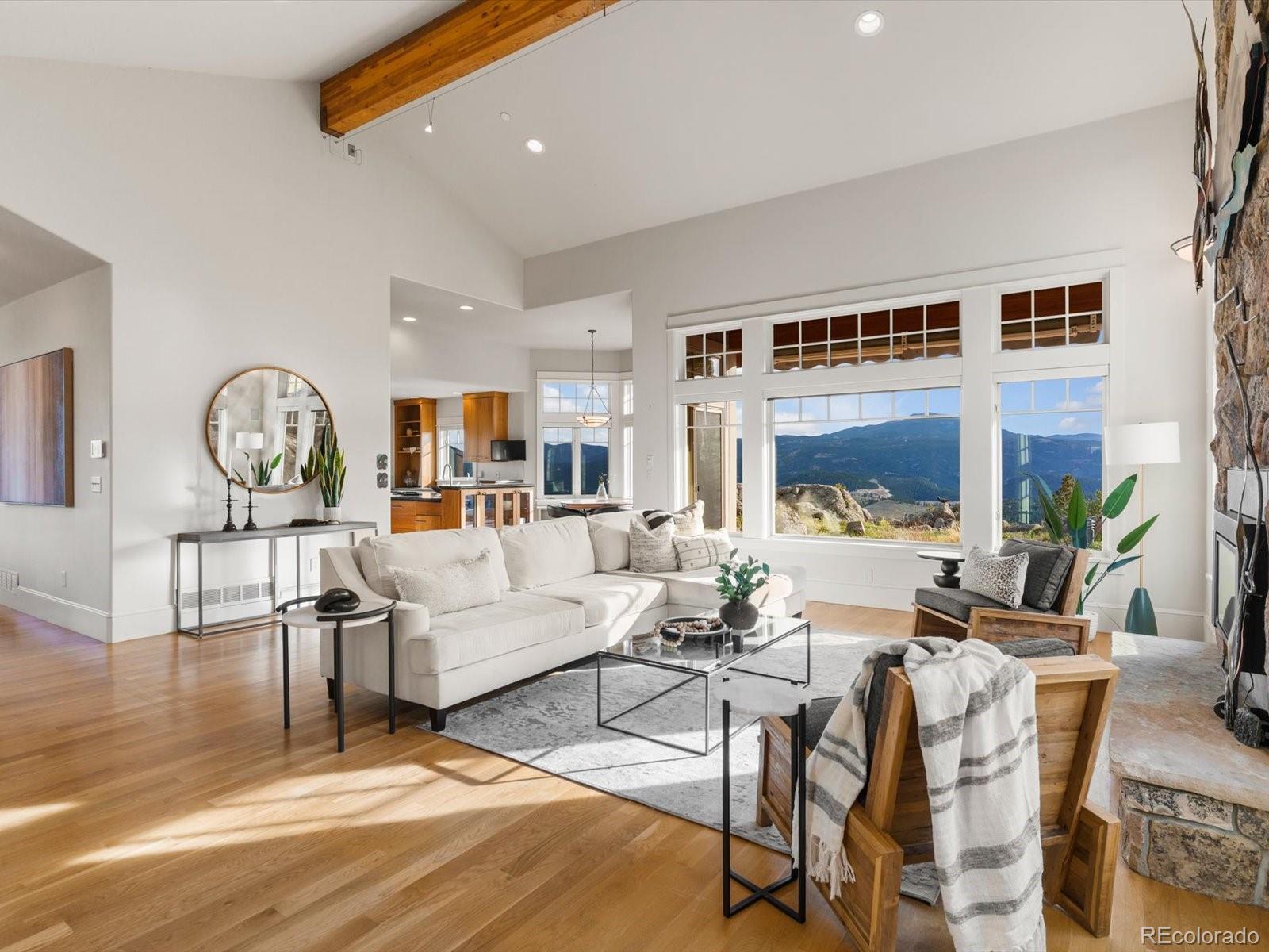 6264 Flagstaff Road Boulder, CO 80302 - Photo 25 of 50 a living room with furniture and a large window