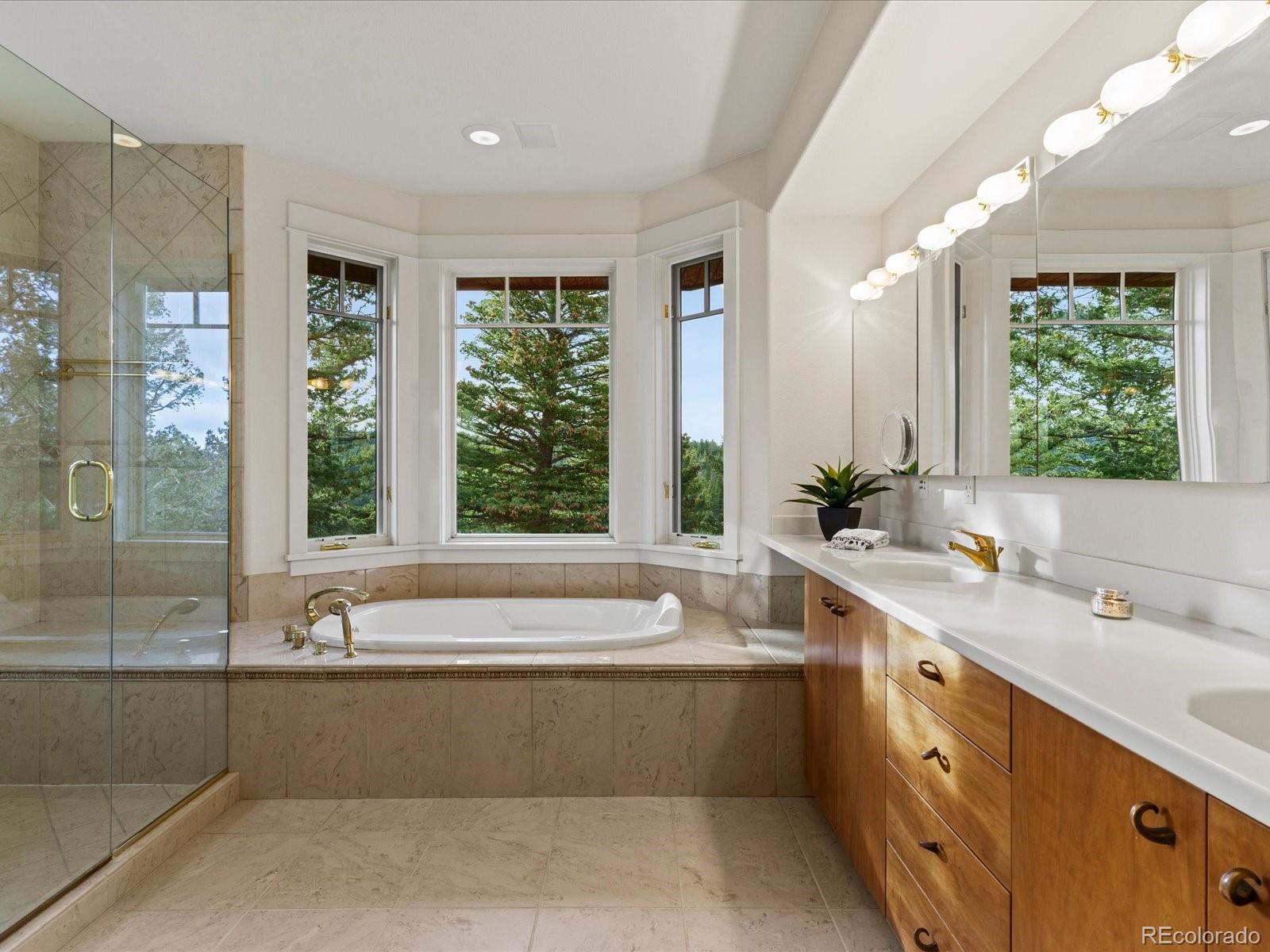 6264 Flagstaff Road Boulder, CO 80302 - Photo 40 of 50 a bathroom with a large tub sink and window