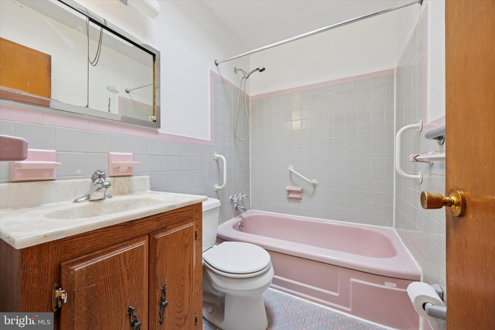 1069 Surrey Road Philadelphia, PA 19115 - Photo 12 of 27 a bathroom with a sink a toilet and shower