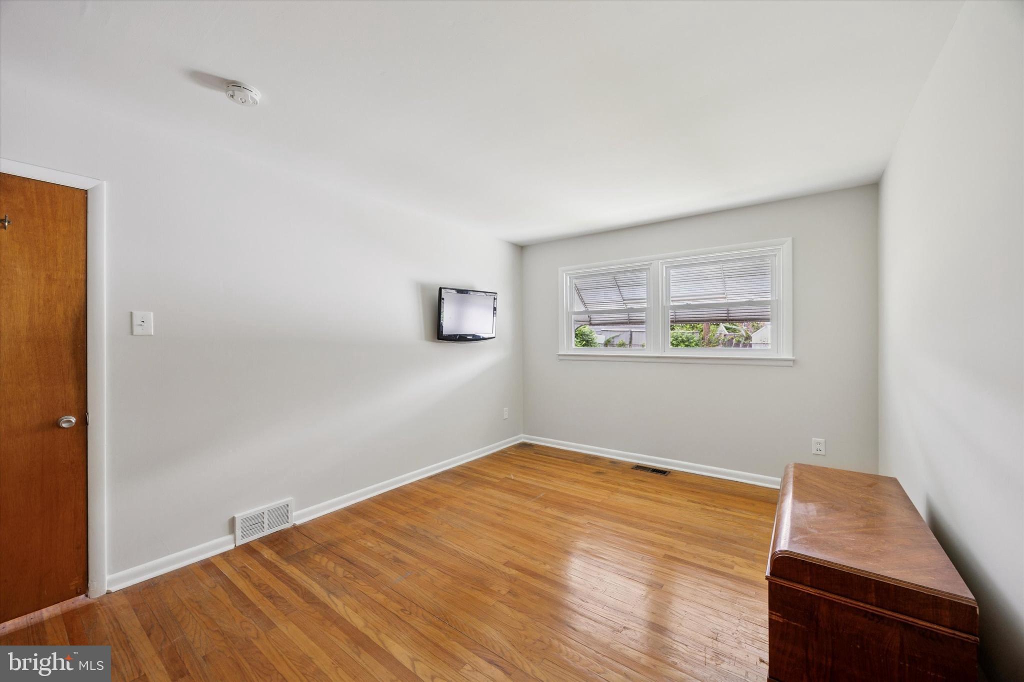 1069 Surrey Road Philadelphia, PA 19115 - Photo 13 of 27 a room with a bed and a window