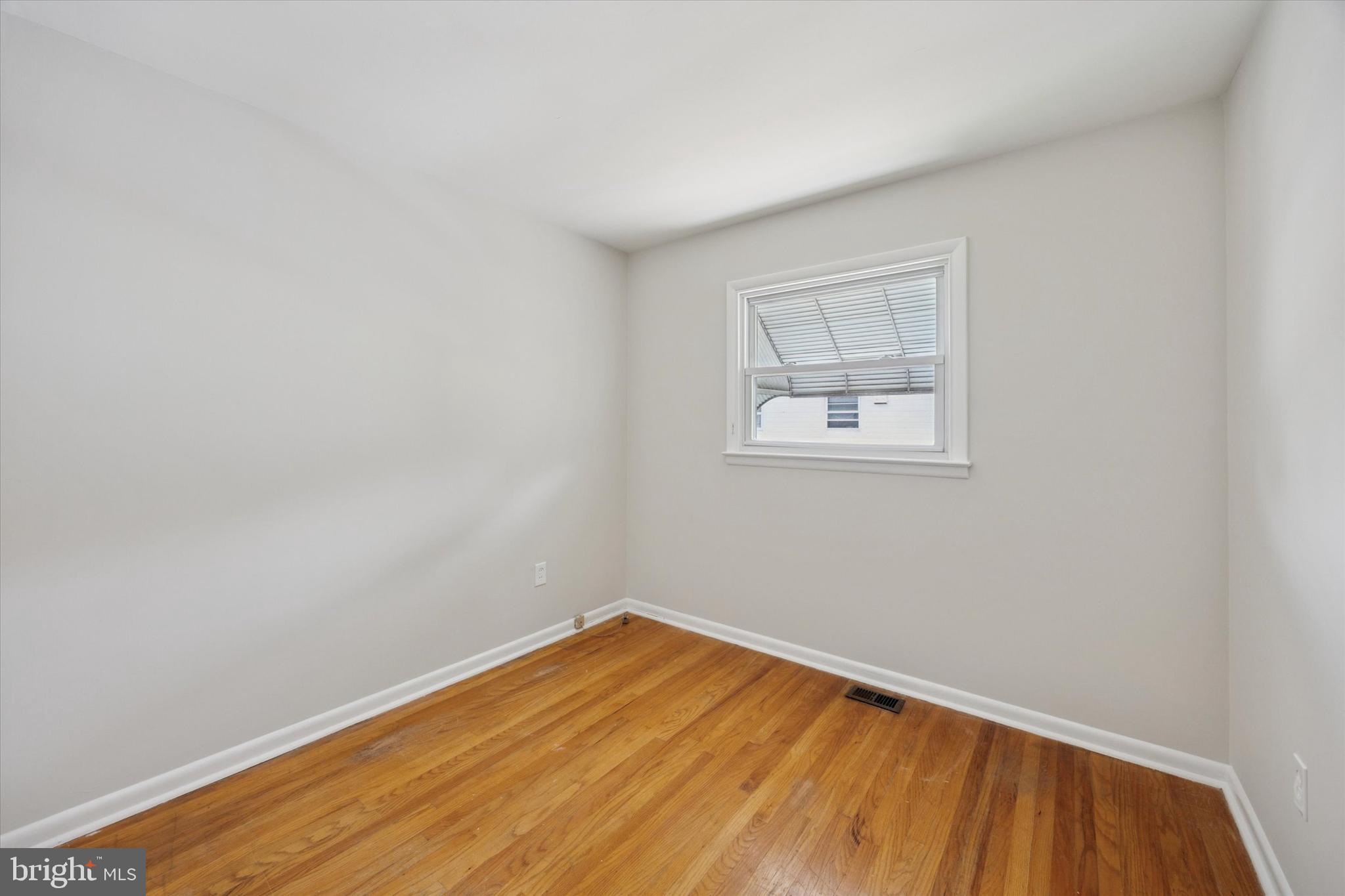 1069 Surrey Road Philadelphia, PA 19115 - Photo 16 of 27 an empty room with a window