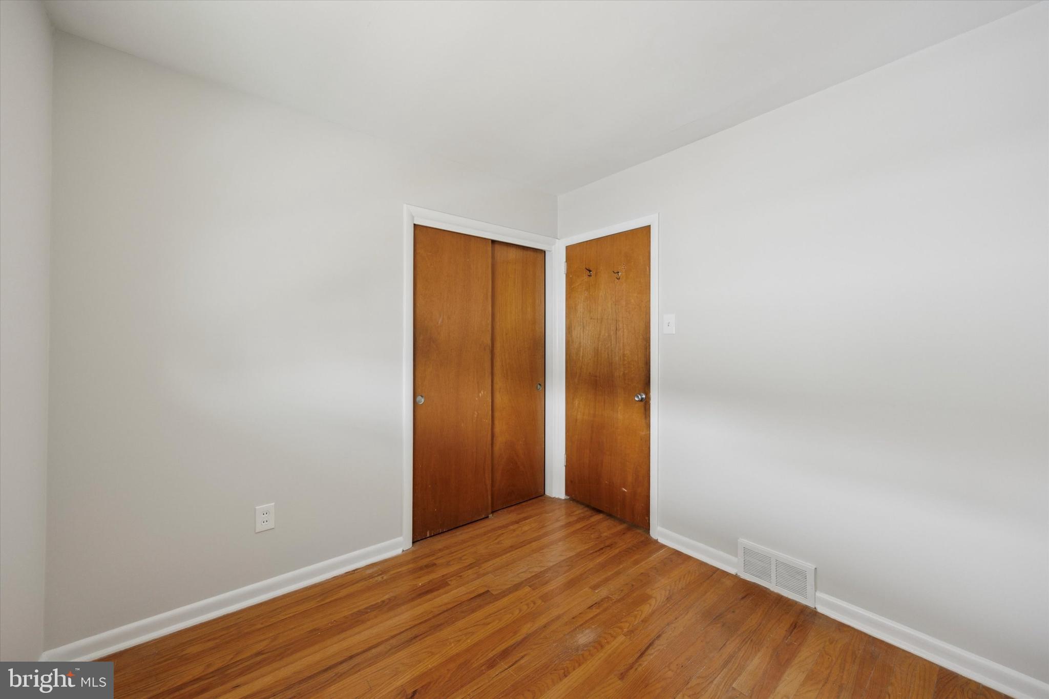 1069 Surrey Road Philadelphia, PA 19115 - Photo 18 of 27 a view of an empty room with wooden floor