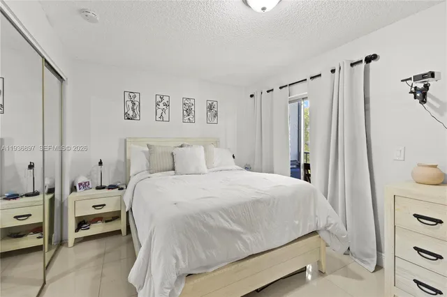 a bedroom with a bed and a cabinets