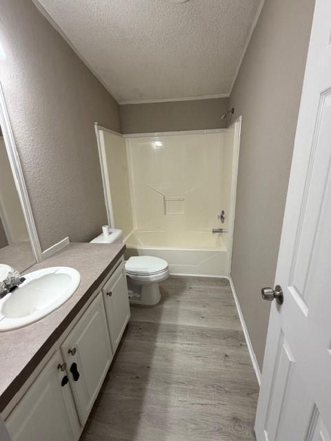 2321 Ridgeview Street Fort Worth, TX 76119 - Photo 6 of 10 Bathroom featuring a white vanity with an integrated sink, a gray countertop, and white cabinetry