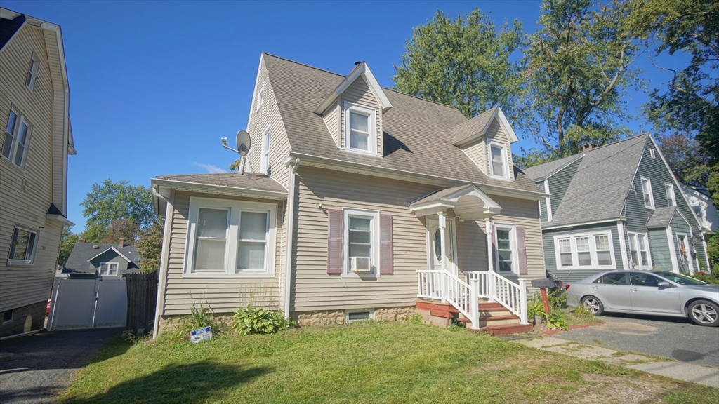 26 Harkness Avenue Springfield, MA 01118 - Photo 1 of 25 a front view of a house with a yard
