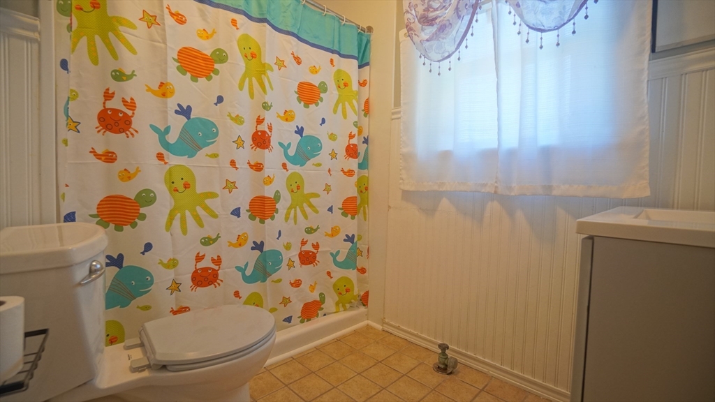 26 Harkness Avenue Springfield, MA 01118 - Photo 13 of 25 a bathroom with a bathtub and shower