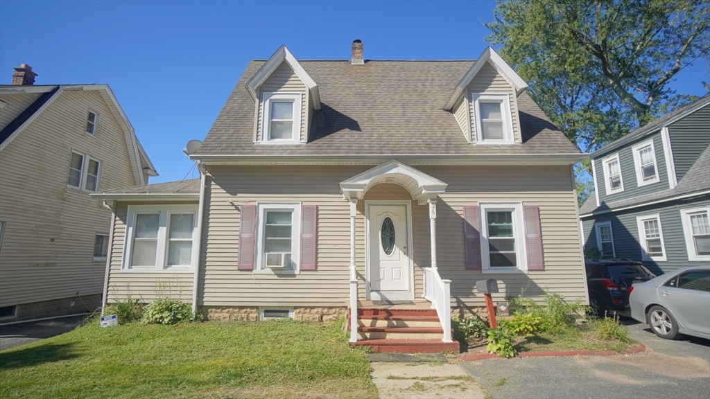 26 Harkness Avenue Springfield, MA 01118 - Photo 2 of 25 a front view of a house with a yard